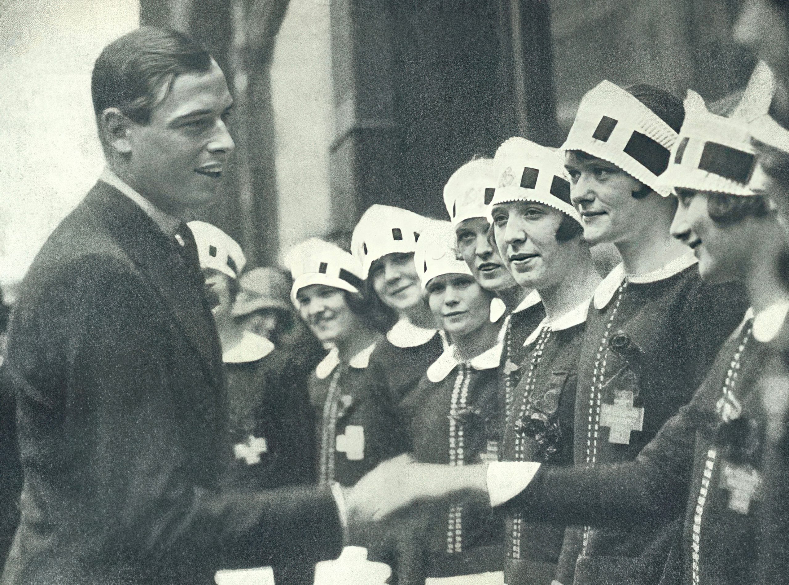 Nippies officially greeting Prince George during a fund raising for St. Georges Hospital on 23 April 1928 
(Read Rose of St. George)