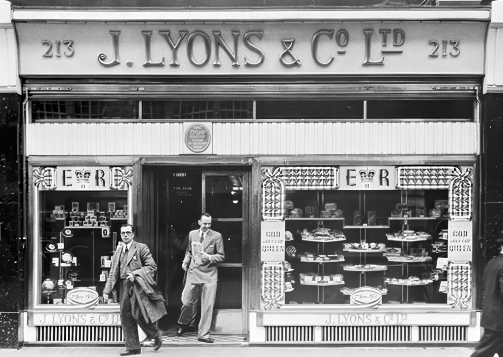 Oliver Standingford and Raymond Thompson outside J. Lyons & Co. first Teashop opened in 1894 on 213 Piccadilly, London