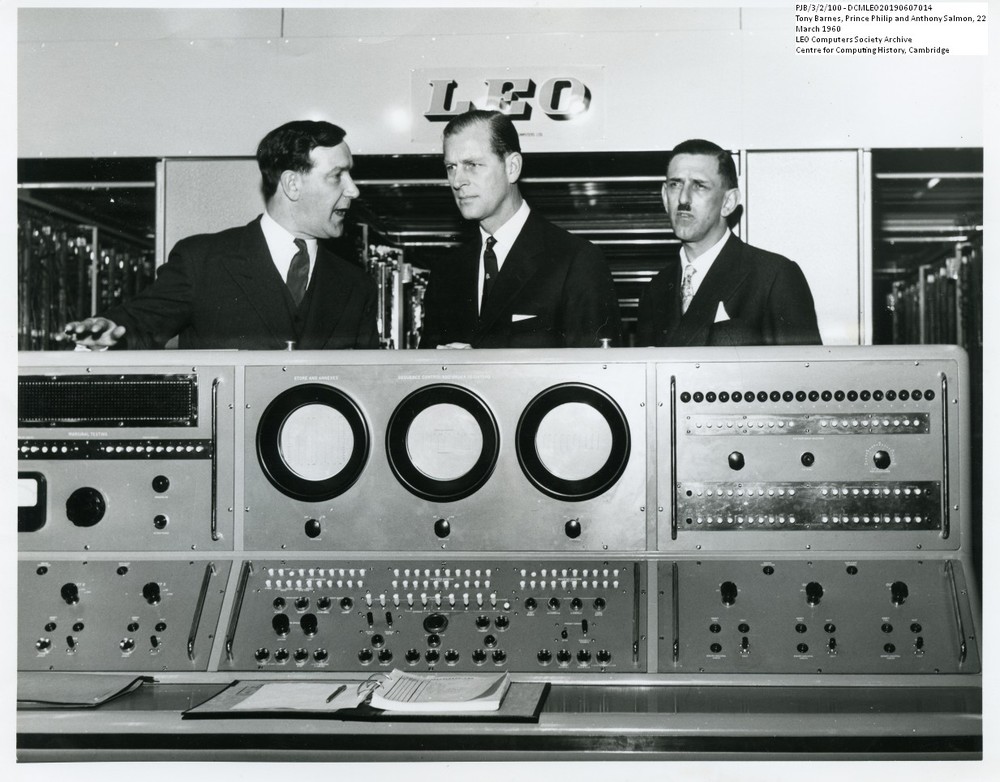 Prince Philip talking with Wony Barnes (left) and Anthony Salmon at LEO's computer works and factory on Minerva Road in Acton, London 22 March 1960